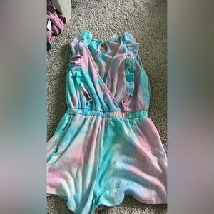 Teal and pink romper brand is Sadie and sage kids XL